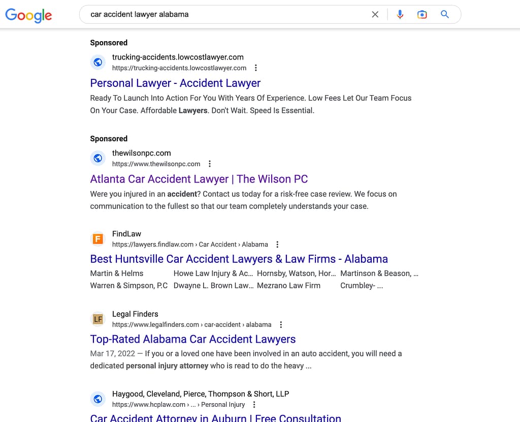 The Wilson PC, a Georgia based car accident law firm, has ads showing for irrelevant searches. Pictured is their ad for the search "Car Accident Lawyer Alabama".