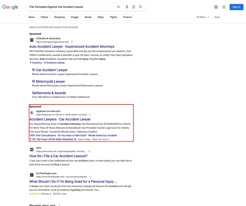 Marasco & Nesselbush, a Rhode Island based personal injury law firm, has ads showing for irrelevant searches. Pictured is their ad for the search "File A Complaint Against Car Accident Lawyer".