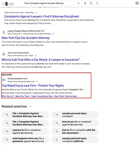 Kwartler Manus, a New Jersey based personal injury law firm, has ads showing for irrelevant searches. Pictured is their ad for the search "File a Complaint Against Accident Attorney".