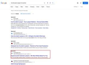 Larry King Law, a Virginia based personal injury law firm, has ads showing for irrelevant searches. Pictured is their ad for the search "Car Accident Lawyer Convention".