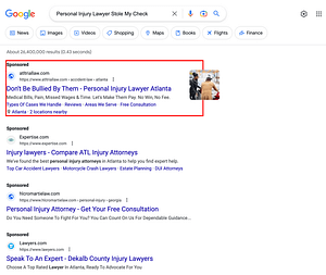 Greathouse Trial Law, a Georgia based personal injury law firm, has ads showing for irrelevant searches. Pictured is their ad for the search "Personal Injury Lawyer Stole My Check".