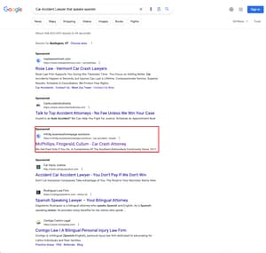 McPhillips, Fitzgerald & Cullum, a New York based personal injury law firm, has ads showing for irrelevant searches. Pictured is their ad for the search "Car Accident Lawyer That Speaks Spanish".